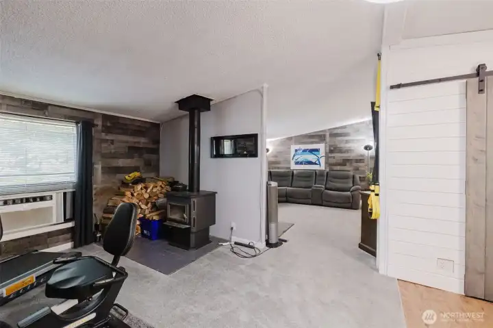 Large wood stove in Family room keeps the house warm in the winter. Wood shed is fully stocked for you too! Large wood stove in Family room keeps the house warm in the winter. Wood shed is fully stocked for you too!