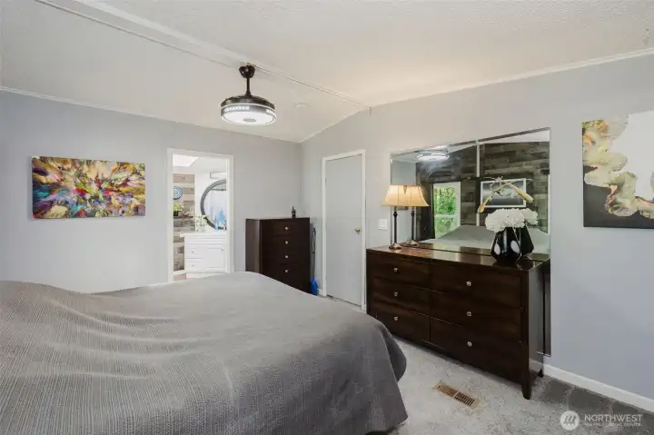 Soothing paint colors soothe the space and make it inviting. Modern light fixture includes a retractable fan. Soothing paint colors soothe the space and make it inviting. Modern light fixture includes a retractable fan.