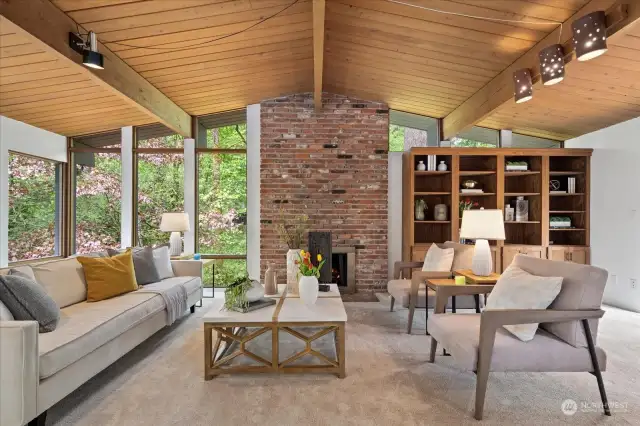 Vaulted beamed ceiling on the upper living area with an architecturally inspired wall of windows allowing maximum light on the upper level.
