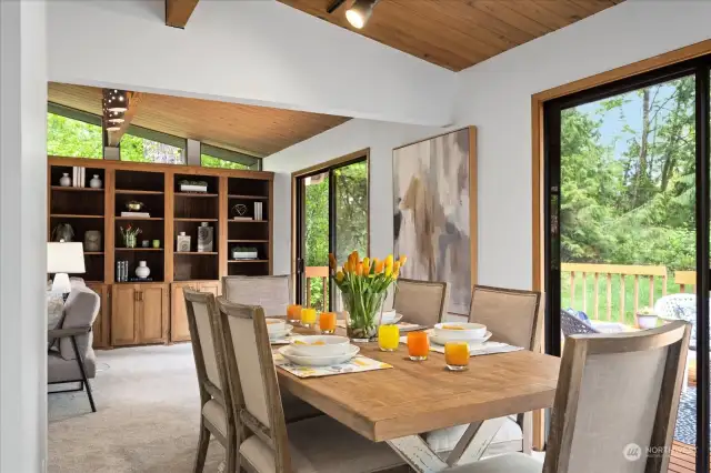 Lovely dining area with duel sliding doors to bring in added light and access to the generous sized deck area.