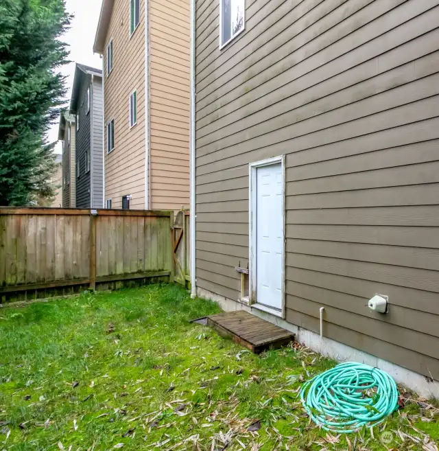 Fully fenced backyard w/private door.