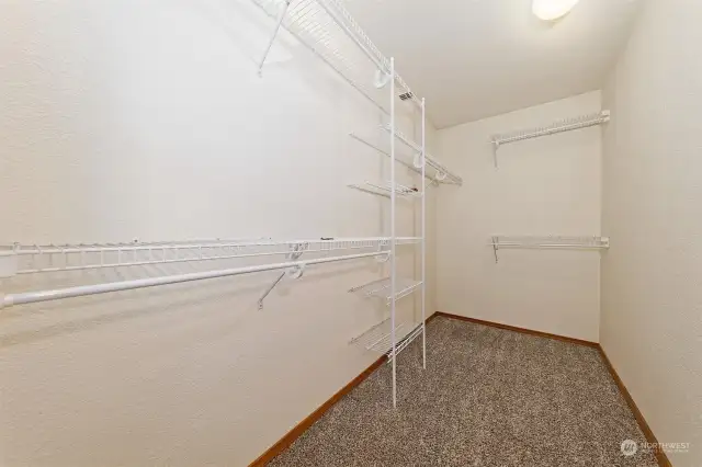 Primary bedroom walk in closet