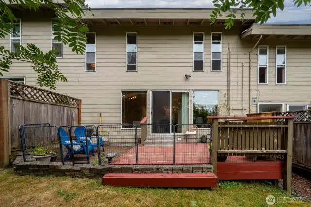 Back of the home with room for setting out a table and chairs