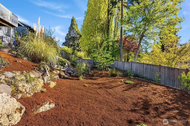 Add a grass area, a play structure or more fruit trees.