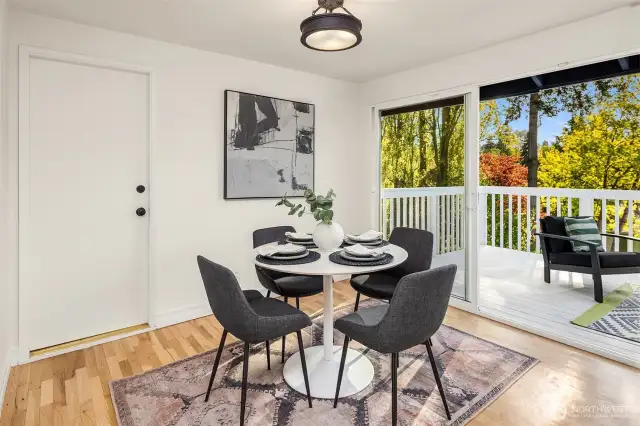 Light filled dining area leads out to deck.