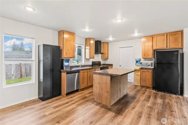 Kitchen with door to laundry.