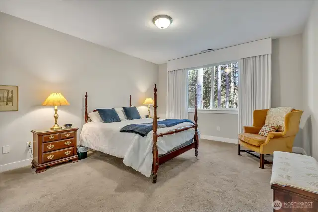Spacious primary bedroom offers respite at the end of the day.