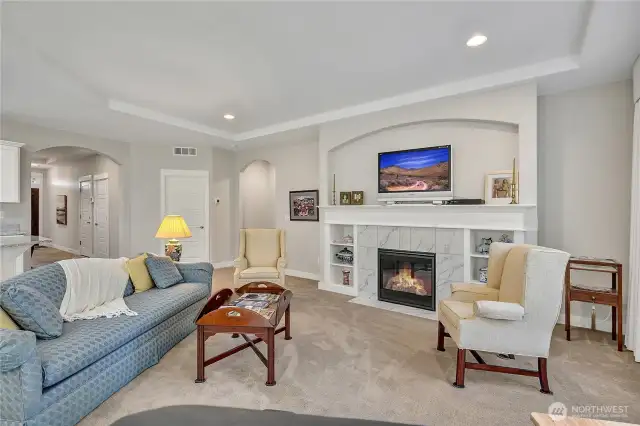 The fireplace creates the perfect ambiance for relaxing or entertaining.