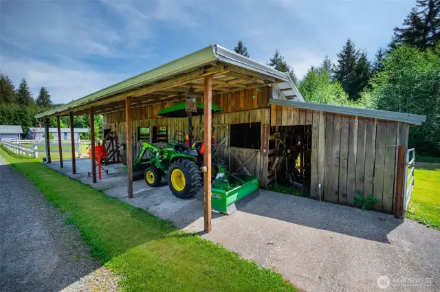 Good size barn with 4 horse stall & nice covered storage too