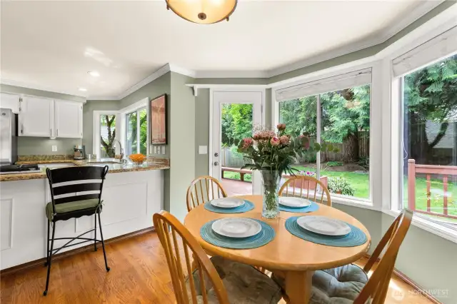 Lots of windows, hardwood floors, and counter seating.