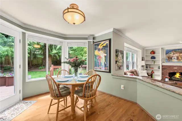 Back door leads out to an expansive deck, and lush back yard.