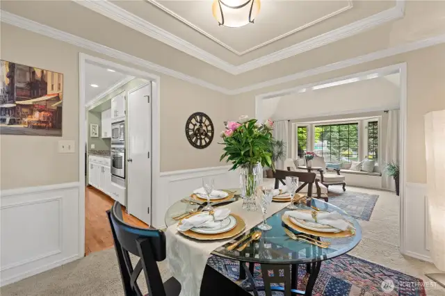 Wainscoting, and dramatic ceiling with millwork.