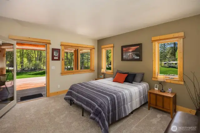 One of 2 Main Level Bedrooms, this one En-suite with a private View Deck of Riverfront and garden area