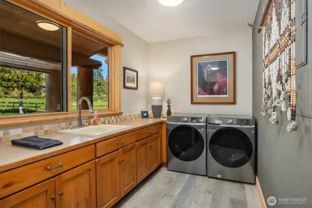 Large utility on main level with extra storage