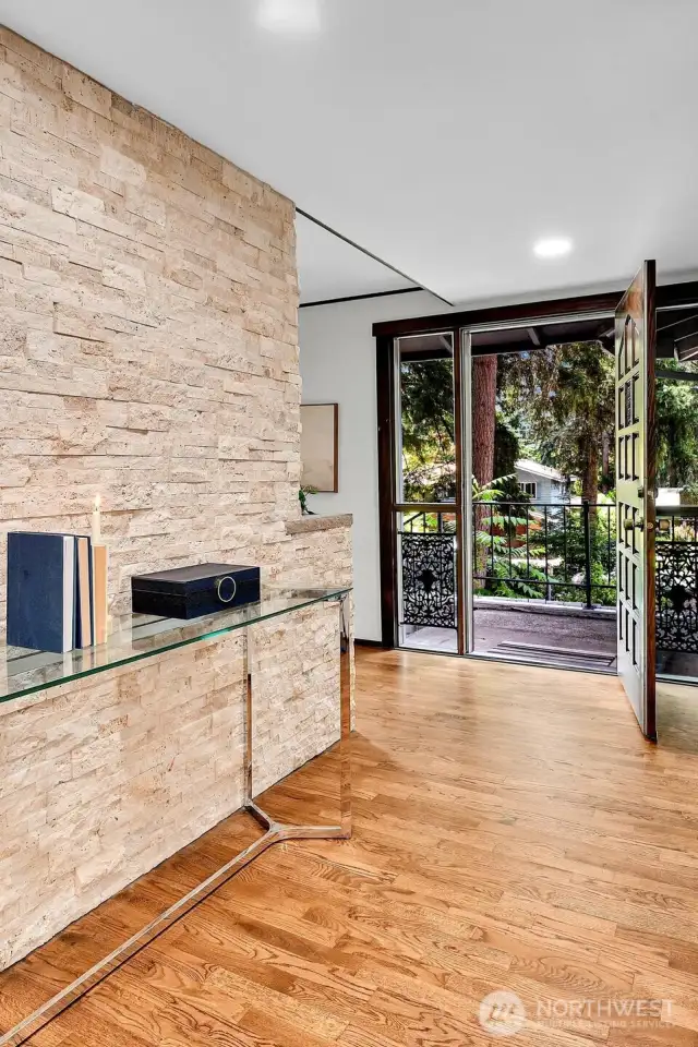 Welcome to #3730. Updates start in the entry with refinished hardwood floors,  recessed LED lighting, and bright new stonework.