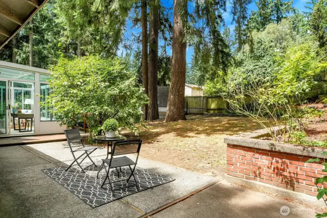Out back, a generous patio connects the dining room to the sunroom and deck. The backyard gate opens onto walking paths and a perfect sledding hill!