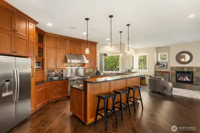 Main floor flooded with hardwoods, wainscoting and millwork for miles