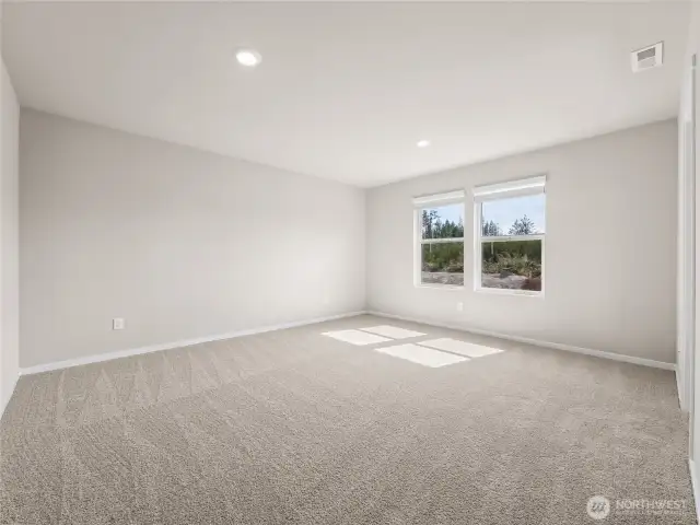 Primary bedroom.  Finishes and options will vary.