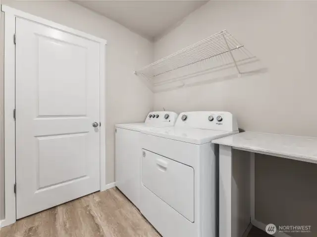 Handy folding table in utility room.  Finishes and options will vary.