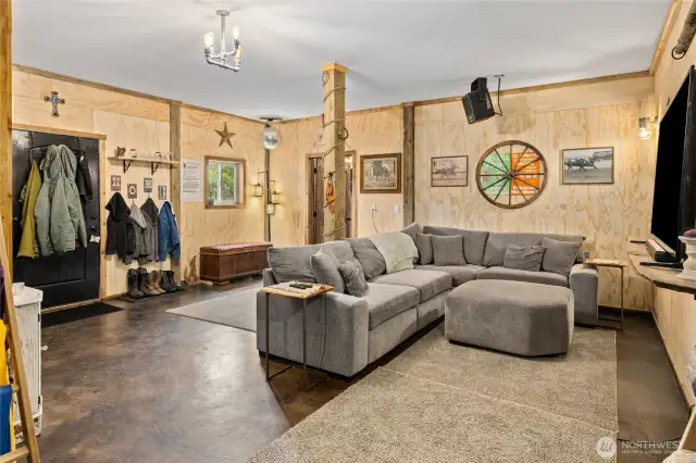 Main floor living space is practical & fun! Easy to maintain stamped concrete floors & room to remove your shoes coming in from the barn!