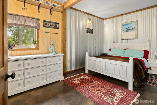 Spacious guest room with large closet! Stained concrete floors, cute metal accent walls.