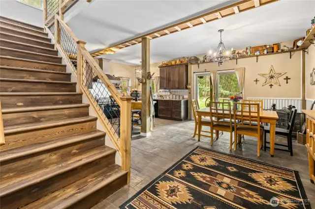 Let's go upstairs! (p.s. don't forget to look under the stairs for the swingin' saloon doors pantry!)