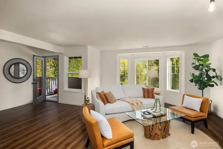 Open living room with ample natural light. Spacious outdoor balcony off of living room to enjoy morning coffee.
