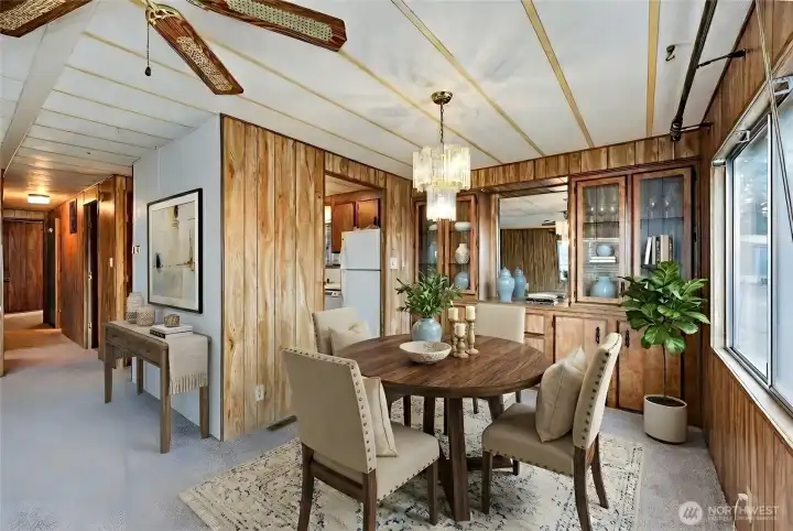 Dining area and built in shelving. Digitally staged.