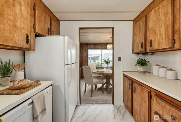 Kitchen, all appliances stay including new dishwasher! Digitally staged.