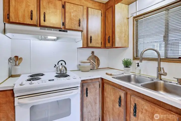 Kitchen, all applinaces stay! Digitally staged.