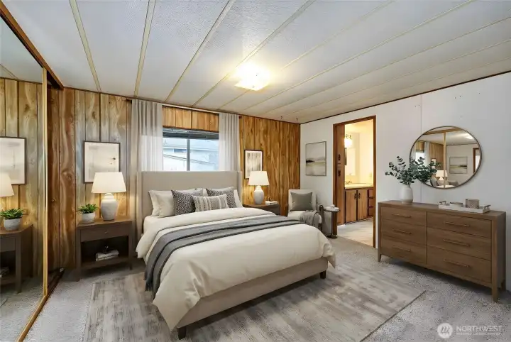 Primary bedroom with bath ensuite. Digitally staged, including curtains.