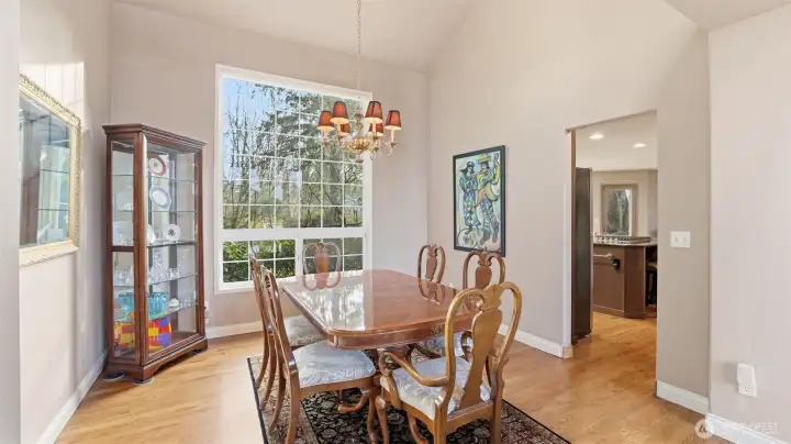 The dining room continues with hardwood floors and vaulted ceilings.  Just steps to the updated kitchen.