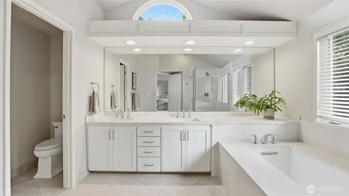 Tile floors, quartz counters, glass wall shower and a sumptuous soak tub.