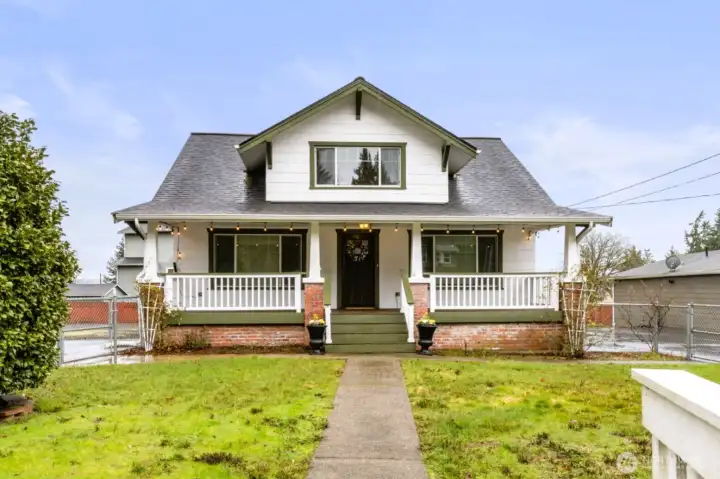 Charming Cape Cod style classic home on large lot with additional detached building.