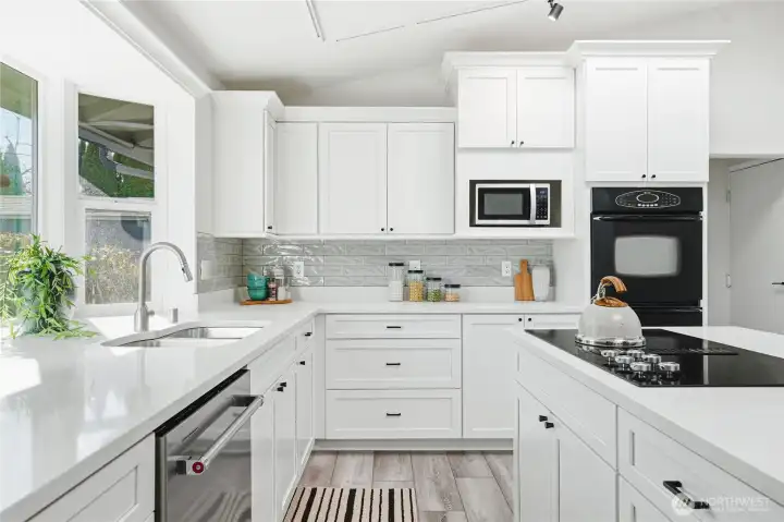 Quartz counters, shaker style soft close cabinets