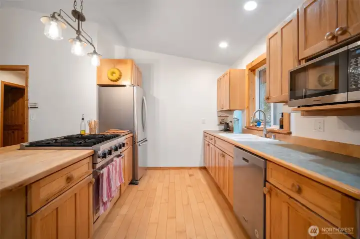 This is a better view of the kitchen and the upgraded gas range is a chef's dream!