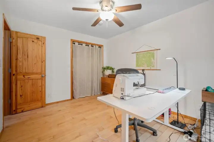 The second bedroom is currently being used as an artist studio/craft room. It, too, has its own sliding glass door to the private grounds!