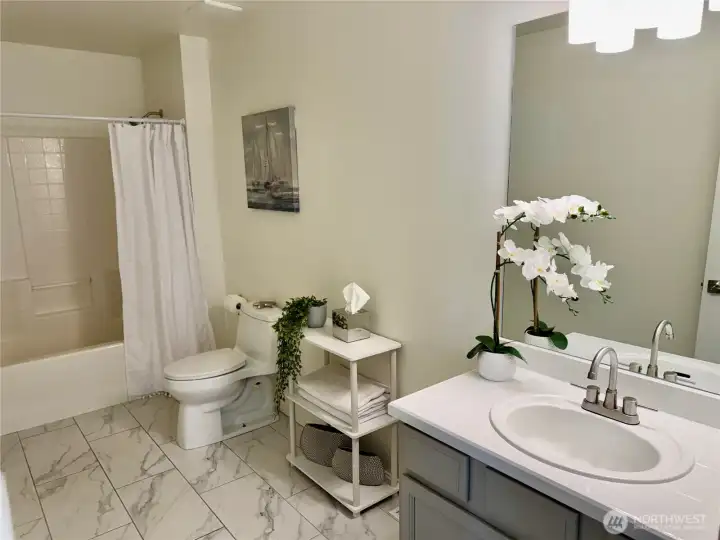 the shared upstairs bath is so large, has room for more storage, or, for a double vanity