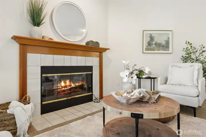 Cozy fireplace that currently has an electirc insert, but is easily converted back to wood burning depending on preference.