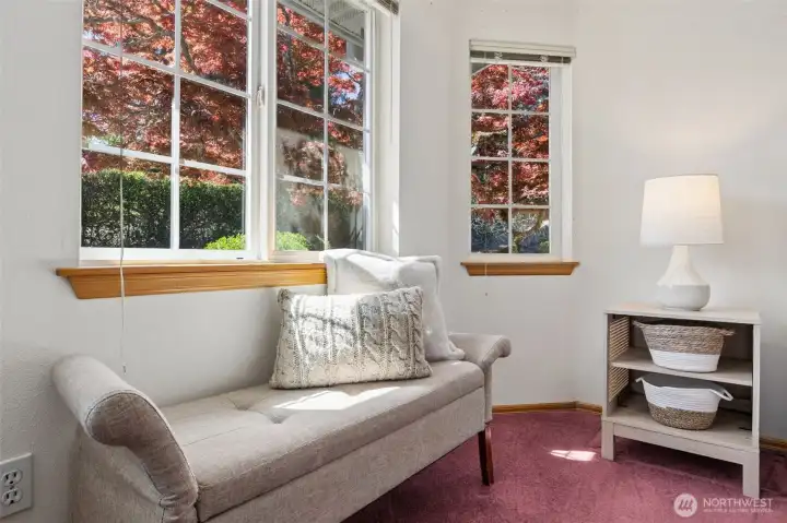 Large windows provide ample light in the primary bedroom. A perfect spot to relax and unwind.
