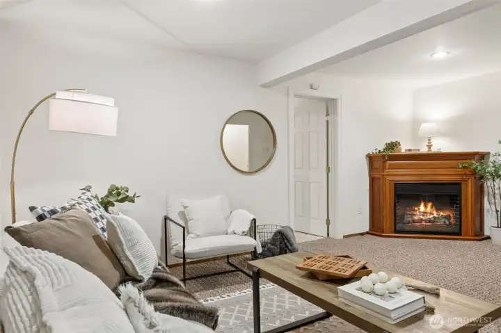 The electric fireplace on the lower level conveys. It adds to the warmth and coziness of the space.