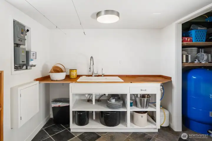 Laundry room with pressure tank