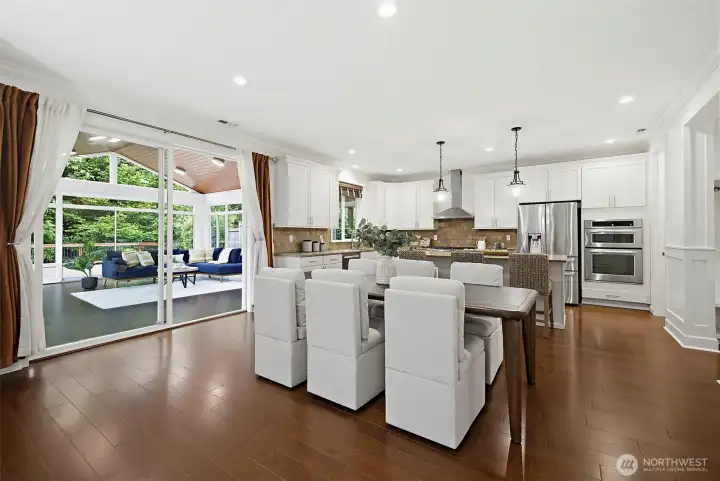 Large dining area overlooking sunroom