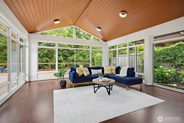 Huge outdoor sunroom with vaulted ceiling and tons of natural light!