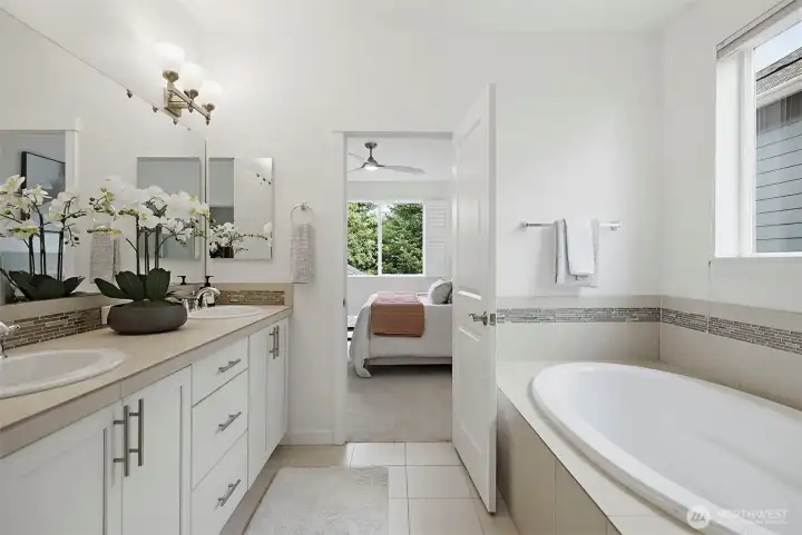 Dual vanities,  Soak-in tub and another closet
