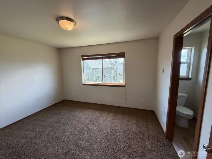 Primary bedroom connected to upstairs bathroom.