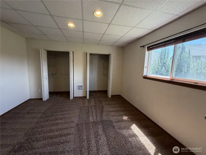 Large downstairs bedroom with dual closets.
