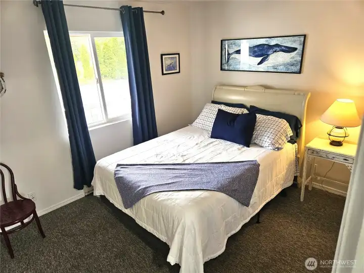 The second bedroom is roomy and bright.