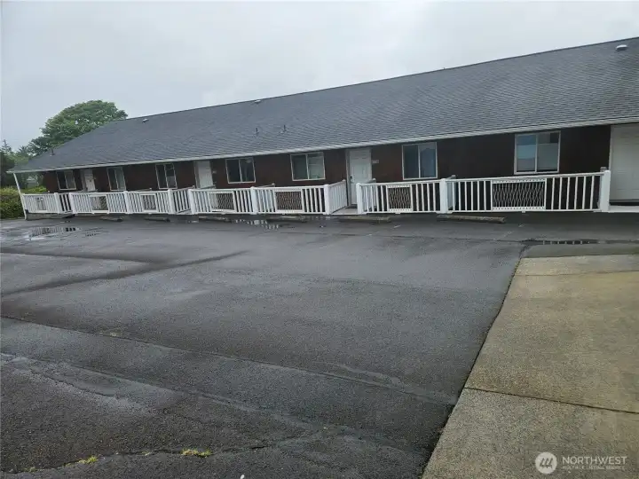 Upper level parking lot with 2 assigned spaces for Unit 202.