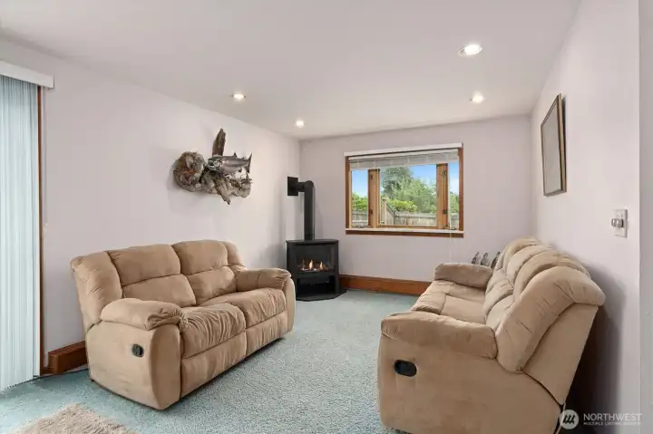 Lower family room w/gas fireplace and slider to back yard.